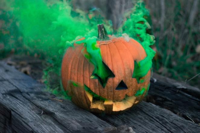 pumpkin jack-o-lantern with green smoke halloween
